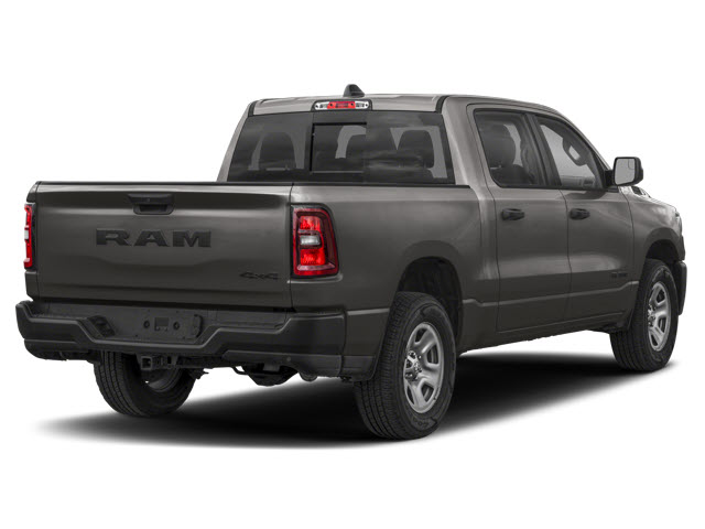 Gray 2026 RAM 1500 pickup truck seen from the rear, showcasing its tailgate and bed.
