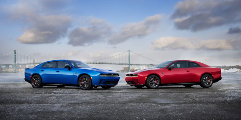 2026 Dodge Charger and Challenger parked side by side in Wichita Falls, TX, showcasing their sleek designs and sporty features.